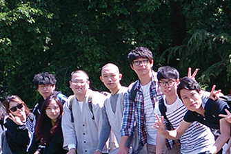 A large group of students posing outdoor.