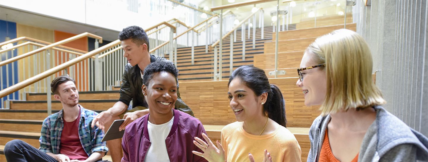 Students sitting on campus socialising