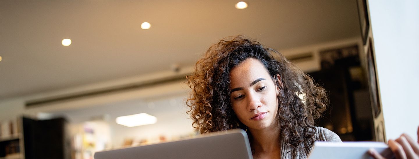 Woman looking at laptop